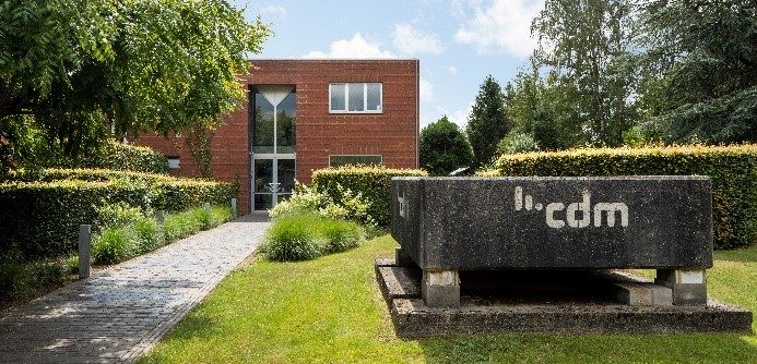 CDM office building surrounded by trees and bushes