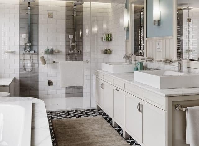 Open plan bathroom, including a bath and a shower, with sink, all white