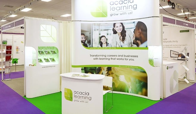 Acacia Learning's pop up stand at a conference.