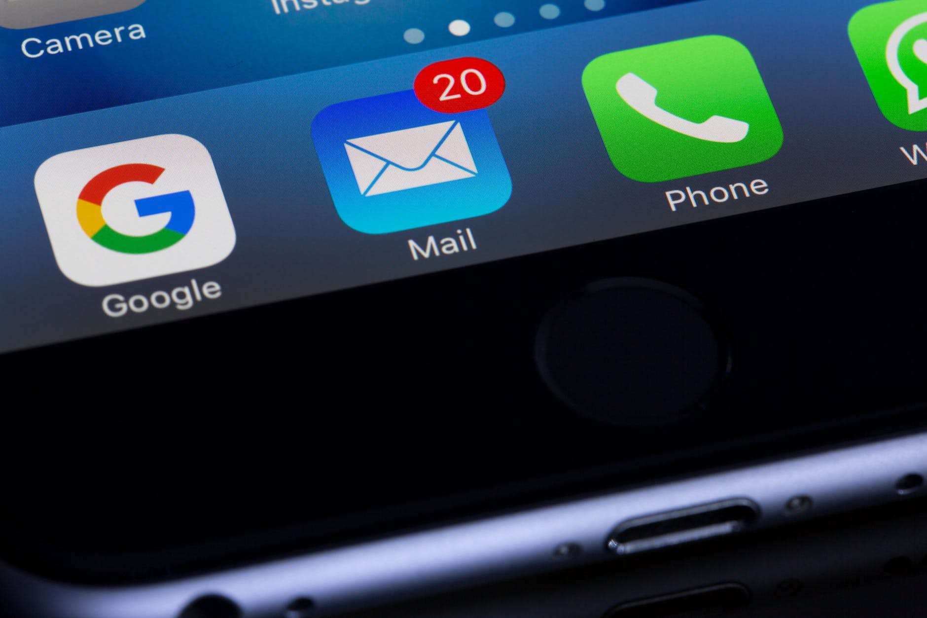 an open smart phone, which is zoomed in on the mail function on the bottom toolbar of iPhone