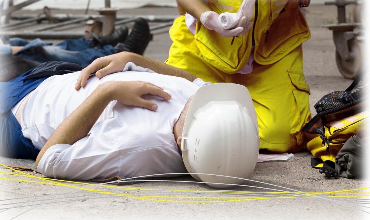 someone laying on the floor receiving treatment from paramedic