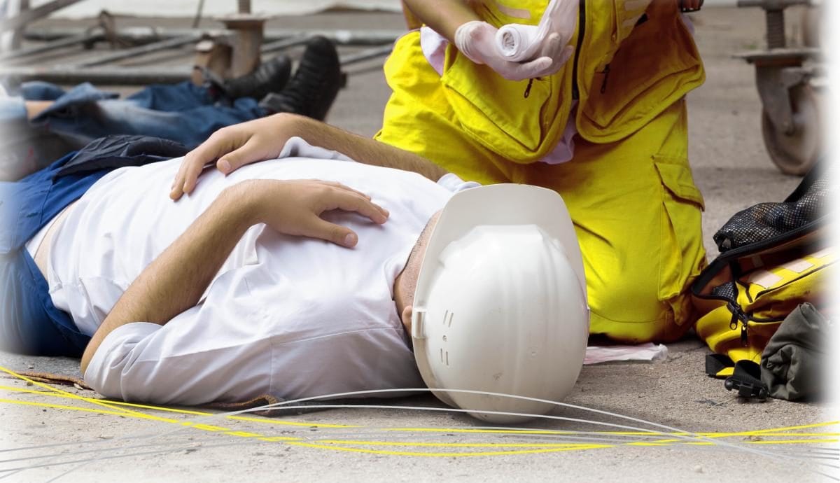 someone laying on the floor receiving treatment from paramedic