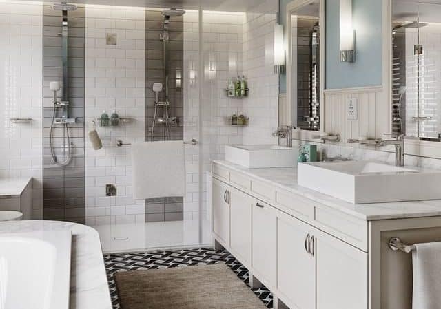 Open plan bathroom, including a bath and a shower, with sink, all white