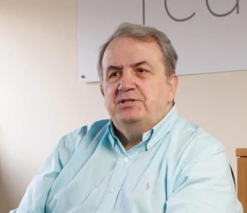 man talking mid-sentence at a camera